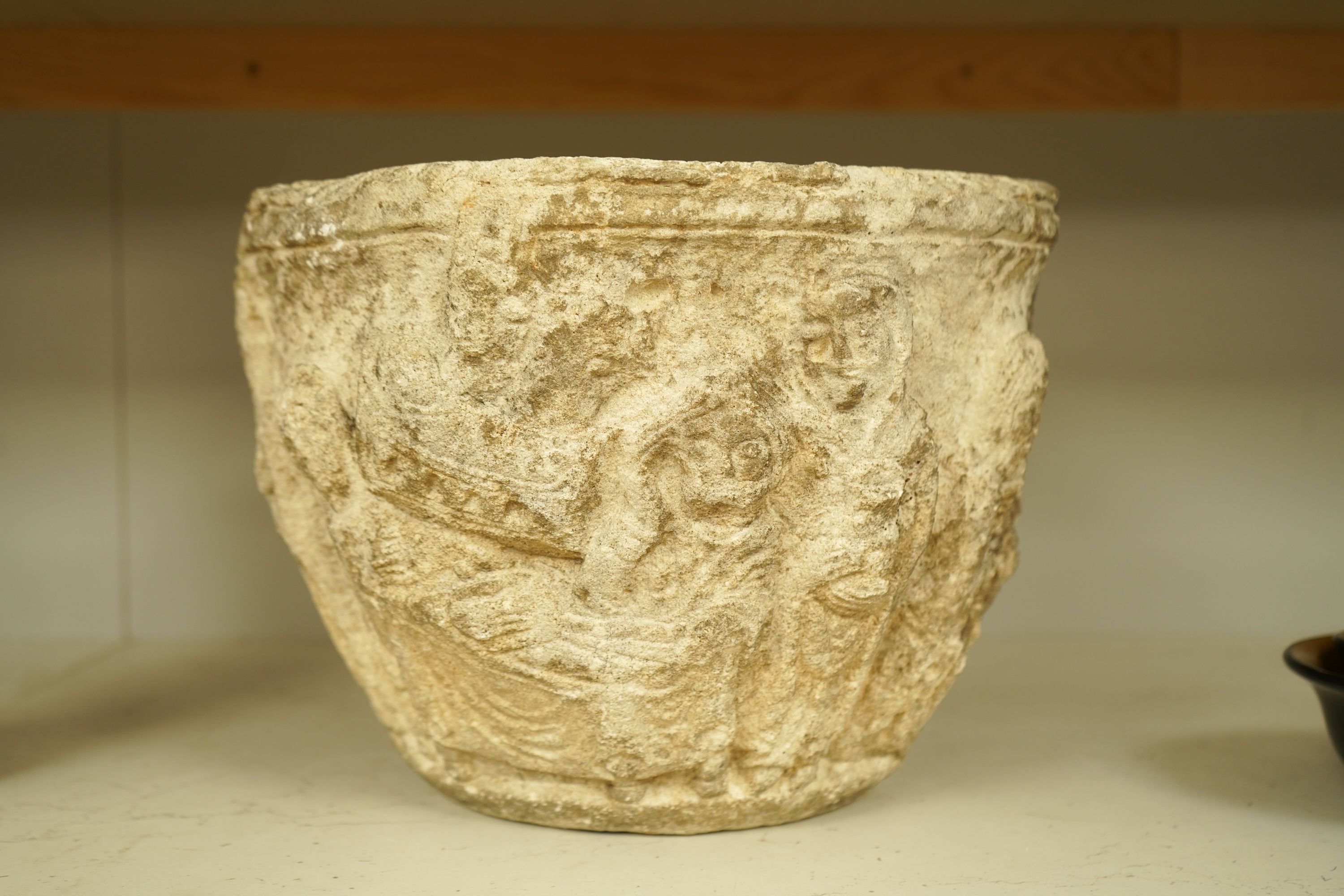 A Romanesque style reconstituted stone planter, 31cm in diameter